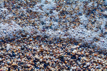 sea pebbles colored granite on the beach