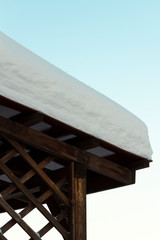 Thick snow on the roof of the gazebo.