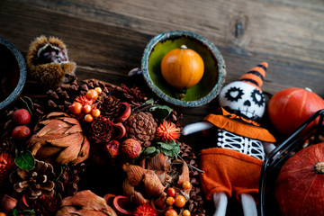Halloween theme. Decorations prepared for Halloween on the rustic wooden table. Place for text.