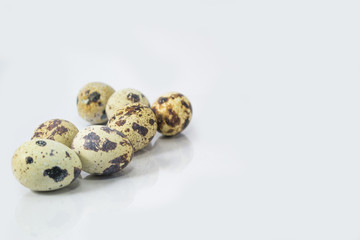 Obraz premium The gang, quail eggs on white background