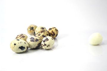 The gang, quail eggs on white background
