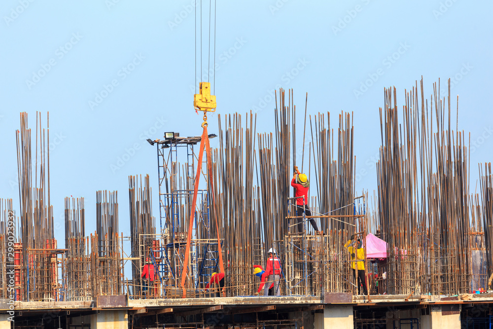 Wall mural construction crews working on high ground heavy industry and safety concept