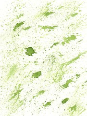 Abstract green background with small dots and spots like spray drawn by watercolor paints. Hand paint texture painted with brush and ink. Great basic of print, badge, party invitation, banner, tag.