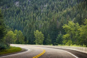Road lane in the valley of mountain. Concept of traveling in the summer, looking for something adventure, take a rest from urban life, spending time with nature.
