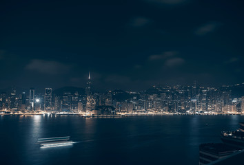 Cityscape and skyline at Victoria Harbour in Hong Kong city at Night