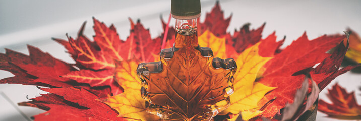 Maple syrup gift bottle in shape of leaf for tourist gift souvenir banner panorama background.
