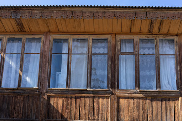 The facade of a wooden building with Windows. Gurzuf, Crimea