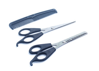 Comb with scissors  on a white background