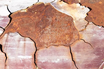 Abstract closeup old rusty steel sheet background, outdoor day light, crack on rusty old steel sheet background