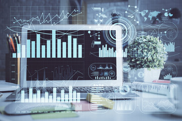 Financial graph colorful drawing and table with computer on background. Double exposure. Concept of international markets.