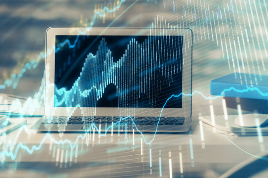 Financial graph colorful drawing and table with computer on background. Multi exposure. Concept of international markets.