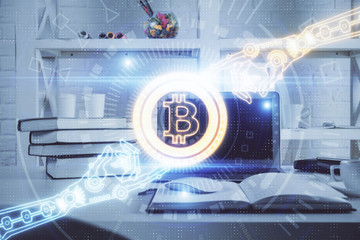 Multi exposure of blockchain theme hologram and table with computer background. Concept of bitcoin crypto currency.