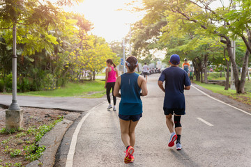 Fototapeta premium People jogging exercise in the park in morning sunrise.
