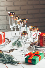 Beautiful red Christmas table setting with decorations close up