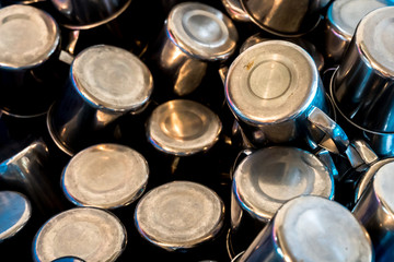 The background of Stainless Steel Glass  stacked  in the basket.