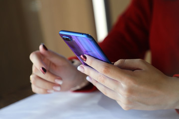 bright smartphone in hand, the use of modern wireless technology