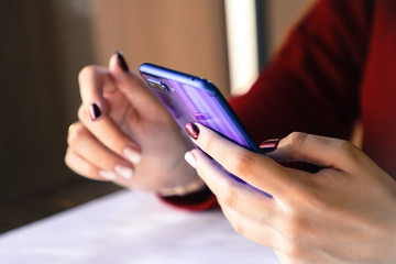 bright smartphone in hand, the use of modern wireless technology