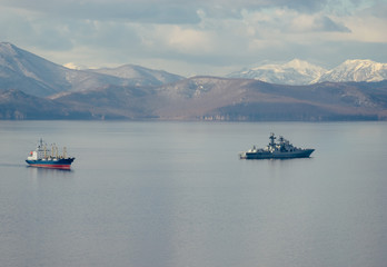 Ships on the background of seascape and mountains.