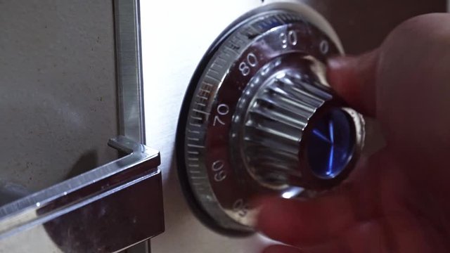 Opening old safe combination lock turning dials.
