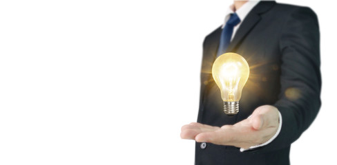 Hand of holding illuminated light bulb, innovation inspiration concept