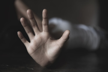 woman raised her hand for dissuade, campaign stop violence against women with copy space, black and...