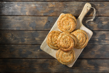 Buns on a wooden Board Board on a wooden table. Top view with space for text