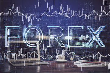 Double exposure of forex graph and work space with computer. Concept of international online trading.