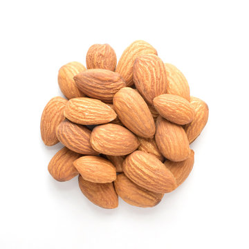 Close up of almonds pile isolated on white background.Above view.Almond is a soure of protein ,Omega 3 and mineral.