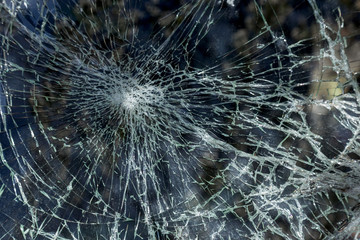 Broken car after an accident. Broken car glass. Broken windshield of car after collision. Robbers...