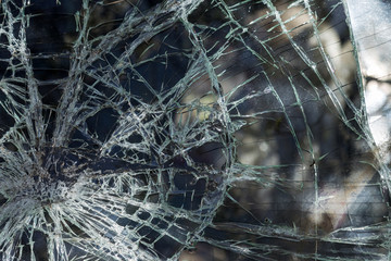 Broken car after an accident. Broken car glass. Broken windshield of car after collision. Robbers...