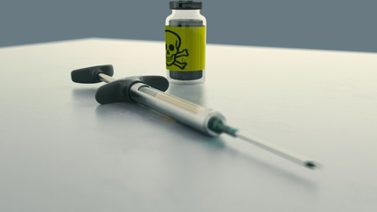 metallic syringe on table with bootle skull and bones poison logo in background