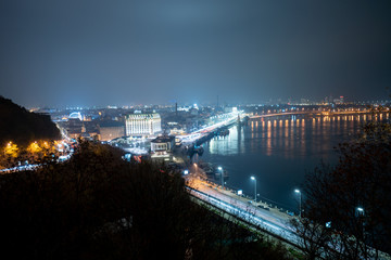 Fototapeta na wymiar Night panorama of the city of Kiev. Bend of the Dnieper River
