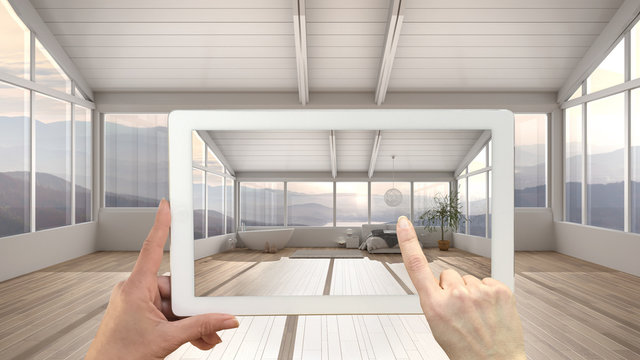 Augmented reality concept. Hand holding tablet with AR application used to simulate furniture and design products in empty interior with parquet, bedroom with bed and bathtub