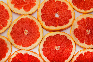 Background formed with sliced grapefruits	