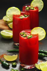 Jalapeno tomato margarita cocktail with lime