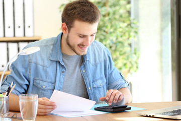 Obraz na płótnie Canvas Entrepreneur calculating using a calculator at office