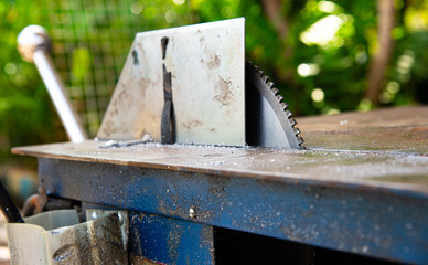 Closeup metal circular saw blade with blurred background.