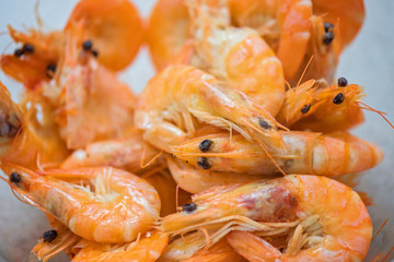 Orange big size shrimps on a glass plate