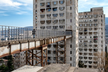 Pedestrian bridge in old soviet modern building. Khrushchovka apartments. Socialist soviet panel...