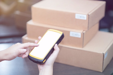 hand holding portable barcode scanner