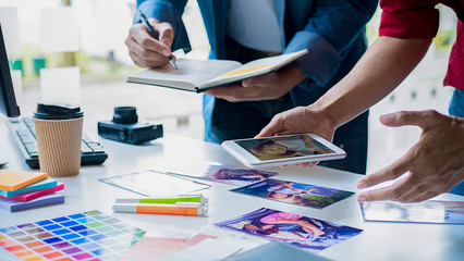 Advertising agency designer creative start-up team discussing ideas in office.