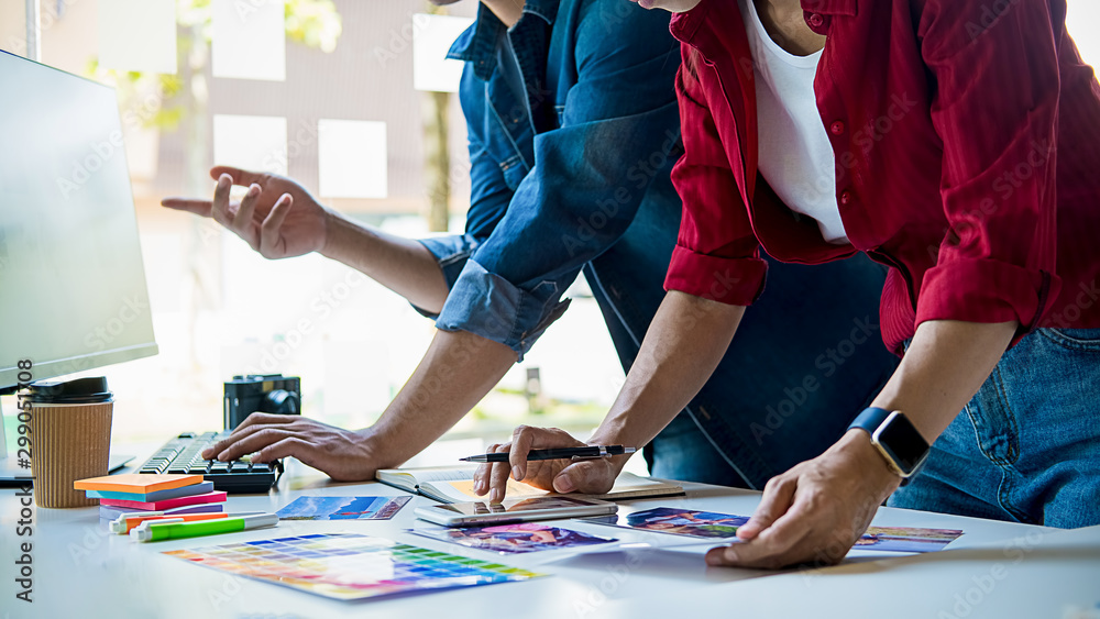 Wall mural advertising agency designer creative start-up team discussing ideas in office.