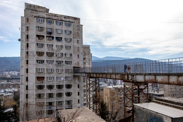 Pedestrian bridge in old soviet modern building. Khrushchovka apartments. Socialist soviet panel building in Tbilisi, Georgia. 