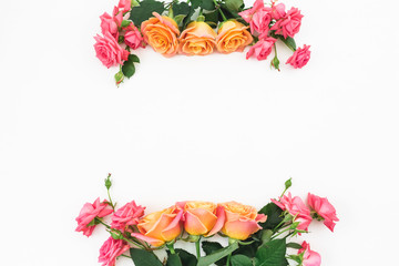 Frame of roses flowers with leaves on white background. Flat lay, top view. Floral composition