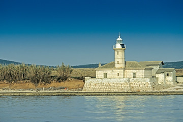 Fototapeta na wymiar lighthouse on port of Losinj; Unije; Cres, Croatia, Europe