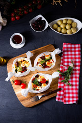 baked small dumplings with zucchini tomatoes and diced sheep's cheese