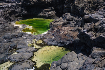Los Charcones area with beautiful green and blue pools of sea water