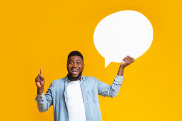 Inspired african american guy man holding empty speech bubble