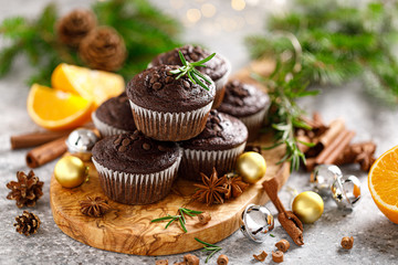 Christmas muffins. Chocolate Xmas or Noel festive bake with decorations and fir tree