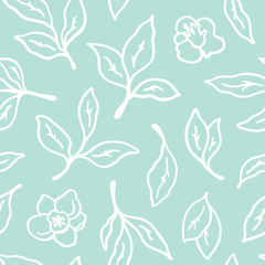 Seamless pattern with tea leaves and flowers.